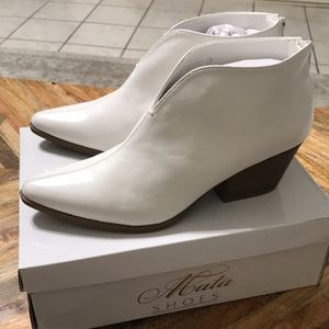 NIB white slit booties with back zipper closure